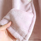Détail des oreilles sur la capuche de la chemise