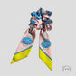 Chouchou foulard en tissu fluide rose à motifs
