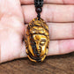 Pendentif Guanyin sculpté en Œil de tigre sur cordon noir