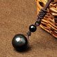 Pendentif en obsidienne œil céleste, reflets colorés visibles