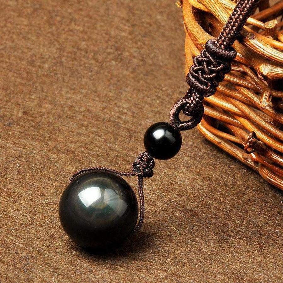 Pendentif en obsidienne œil céleste, reflets colorés visibles