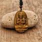 Amulette Bouddha en Œil de Tigre sur fond neutre