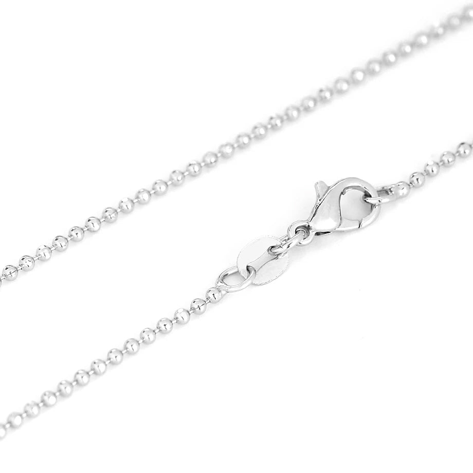 Pendentif tube en pierre, perle assortie et cordon noir