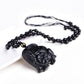 Collier en obsidienne avec pendentif éléphants sculptés