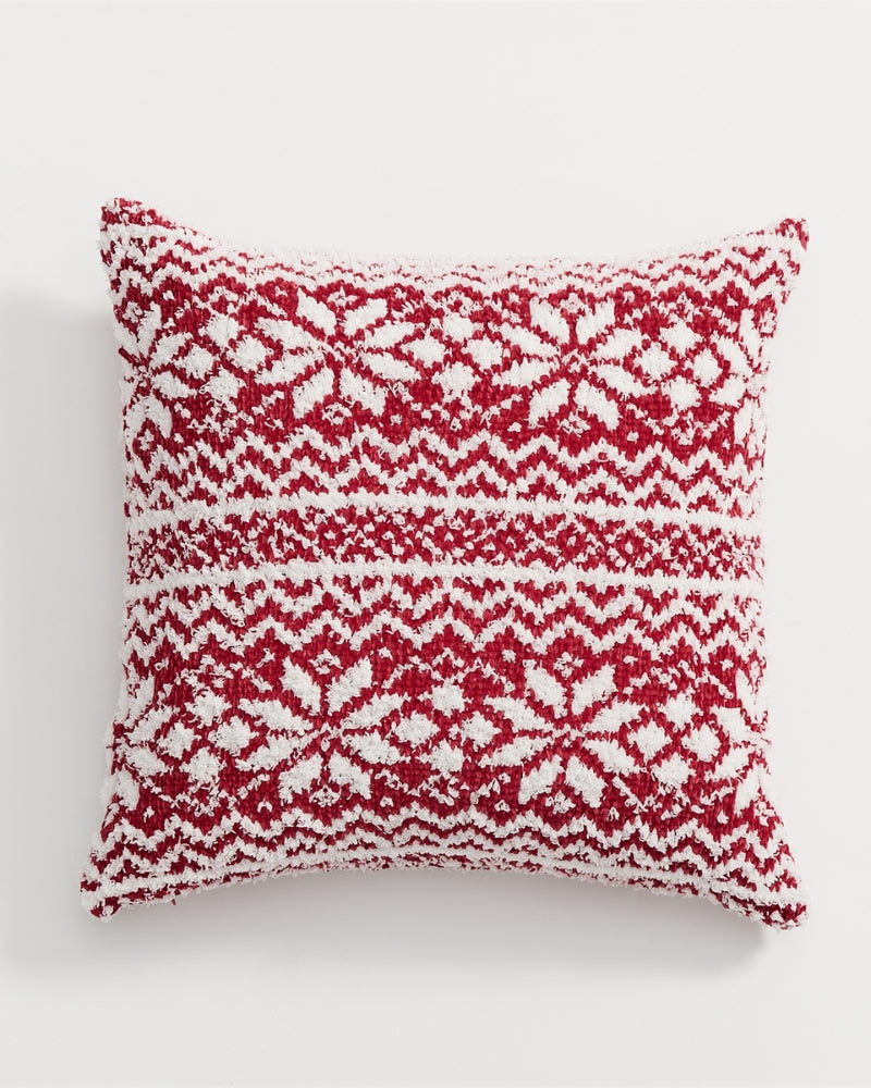 Coussin décoratif sur chaise, ambiance chaleureuse de Noël