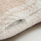 Gros plan sur texture douce du coussin beige