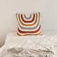 Coussin aux motifs hippie avec teintes vives et variées