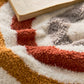 Détail des coutures et couleurs du coussin bohème