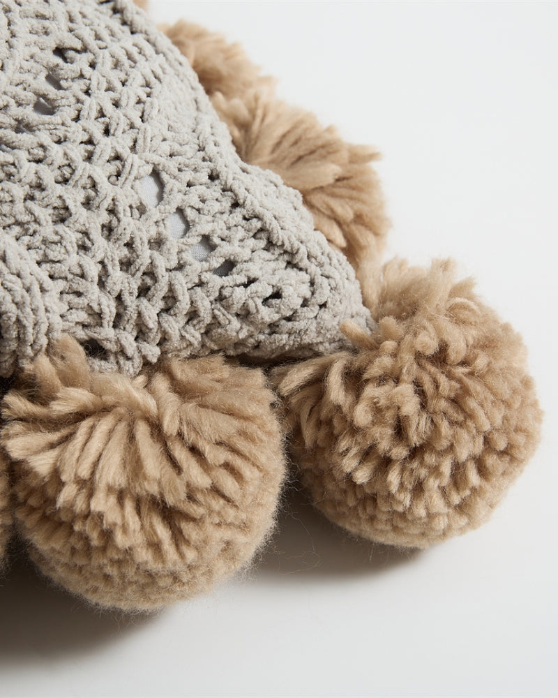 Vue de côté du coussin en tissu mouton