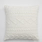 Coussin blanc en microfibre sur un canapé