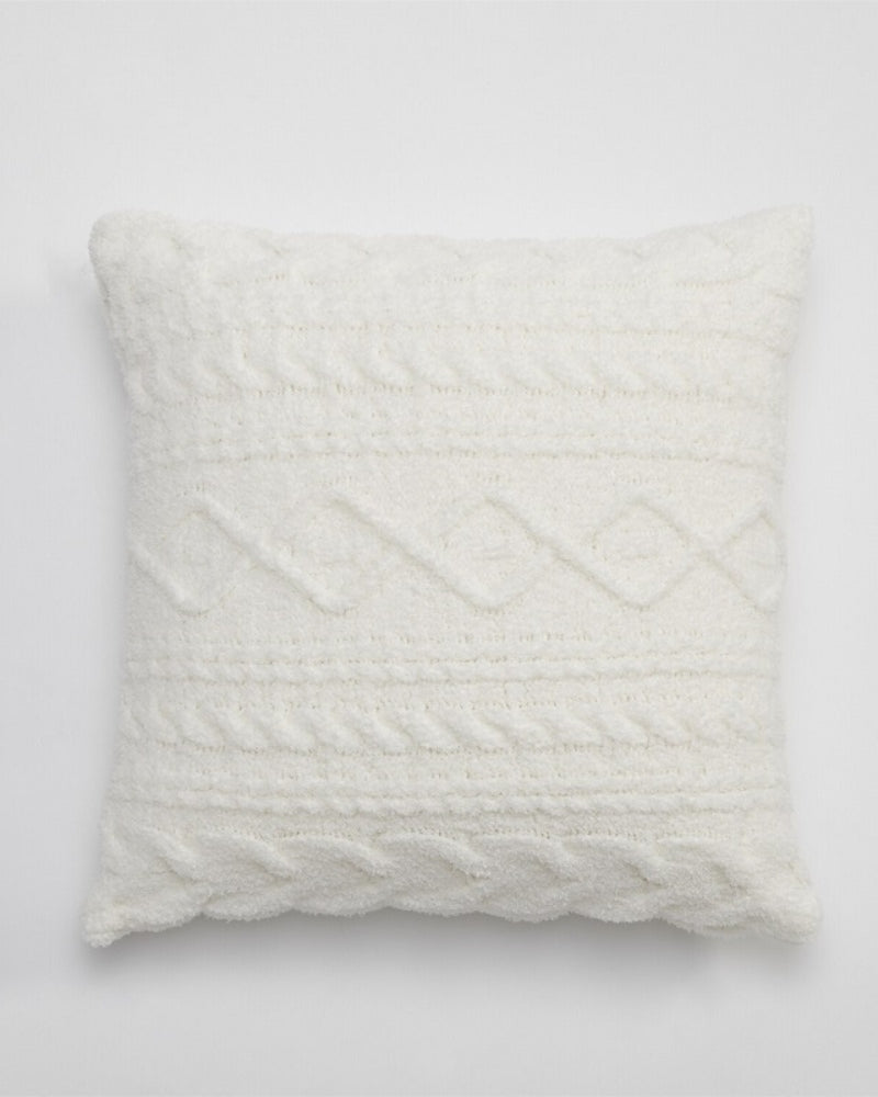 Coussin blanc en microfibre sur un canapé