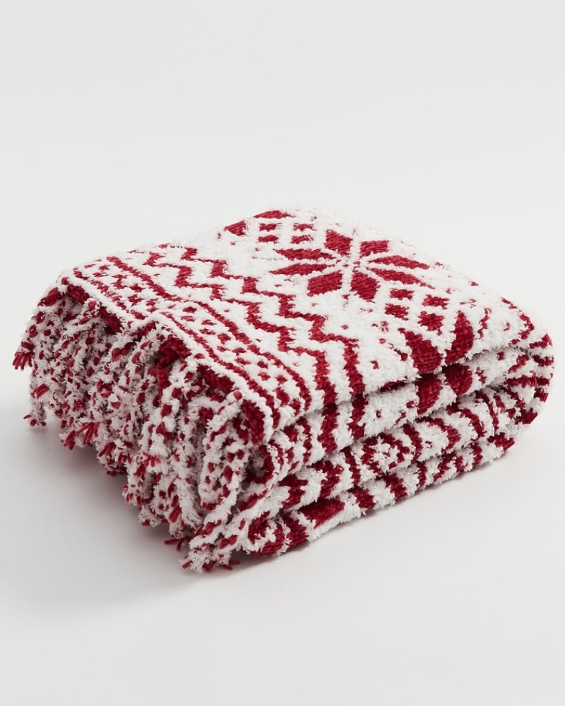 Vue rapprochée des motifs flocons sur fond rouge