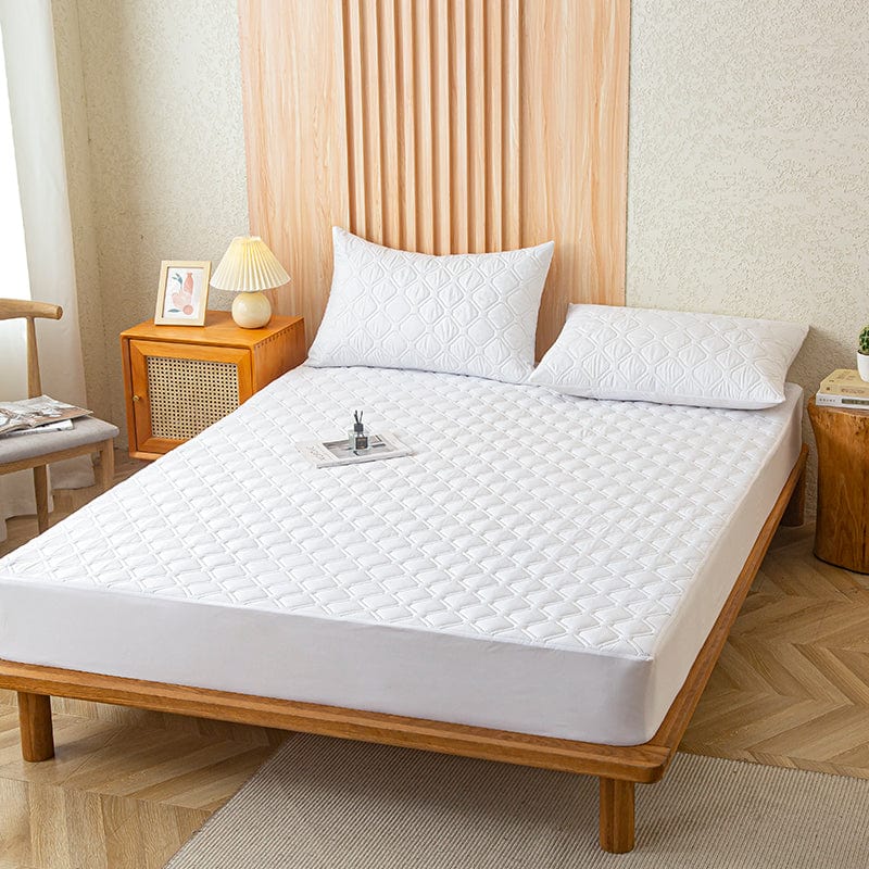 Drap housse blanc imperméable sur un lit
