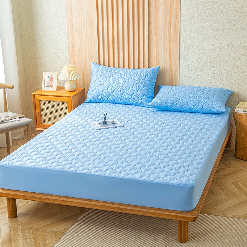 Drap housse bleu ciel sur matelas, vue de dessus