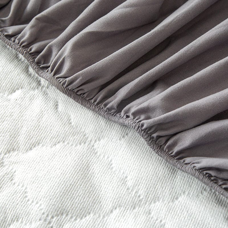 Vue latérale du drap housse imperméable couvrant un matelas