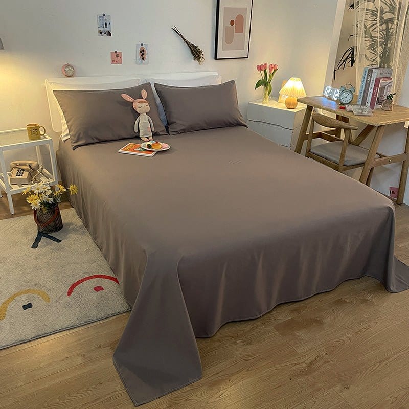 Gros plan sur la texture douce d'un drap housse gris