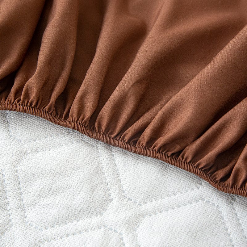 Détail des coins élastiques du drap housse marron