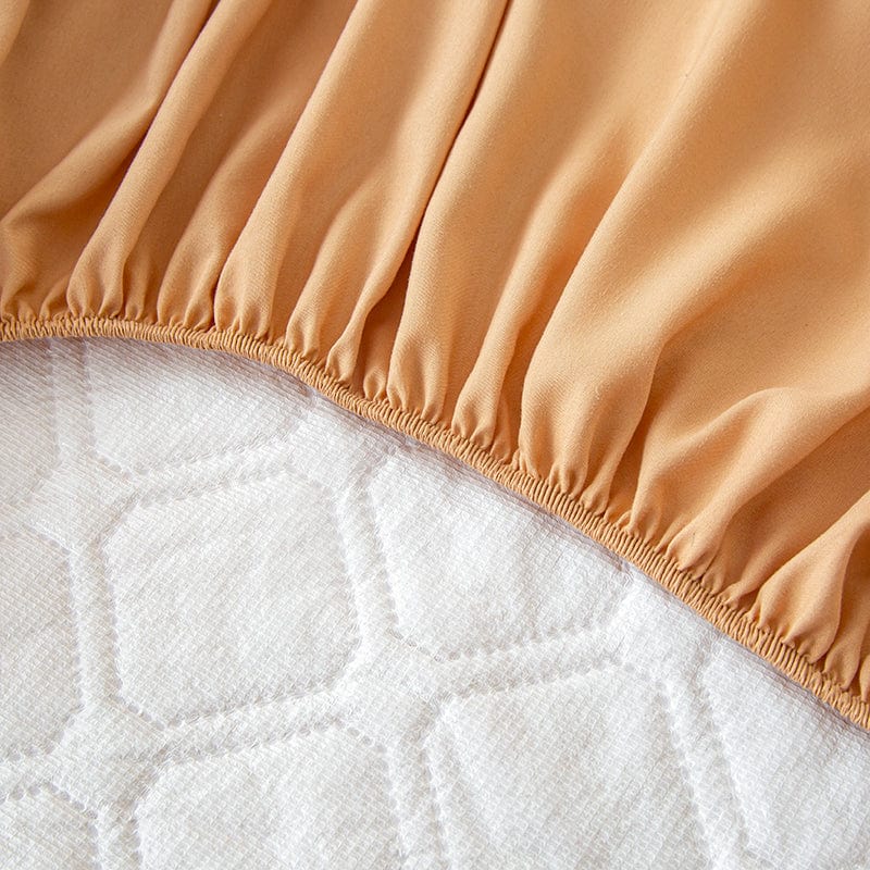 Drap housse en cours de lavage en machine