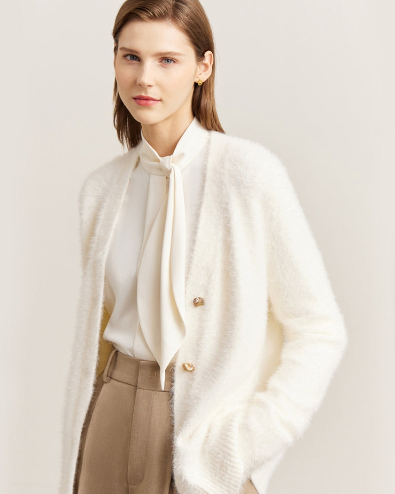 Mannequin portant le gilet avec un bas camel et bottines