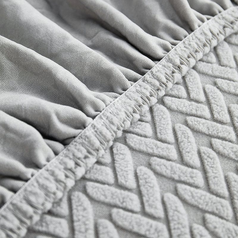 Housse polaire grise ajustée sur coussin, vue de dessus