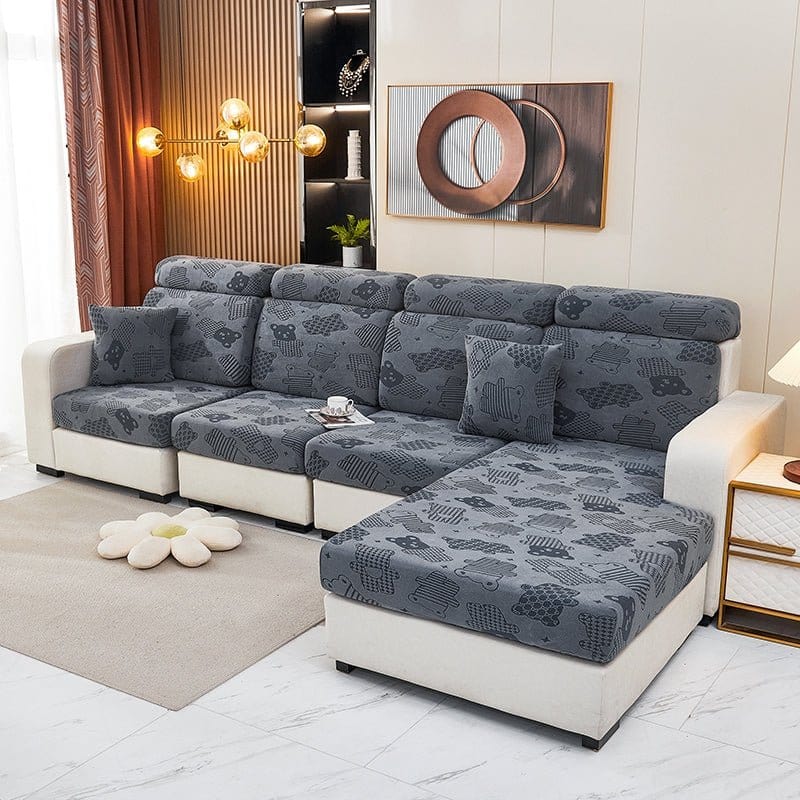 Housse polaire grise avec motif ours sur coussin de canapé