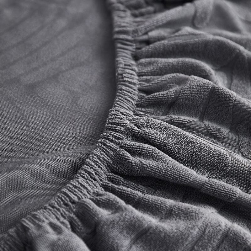 Texture polaire grise avec motifs pour protection de canapé