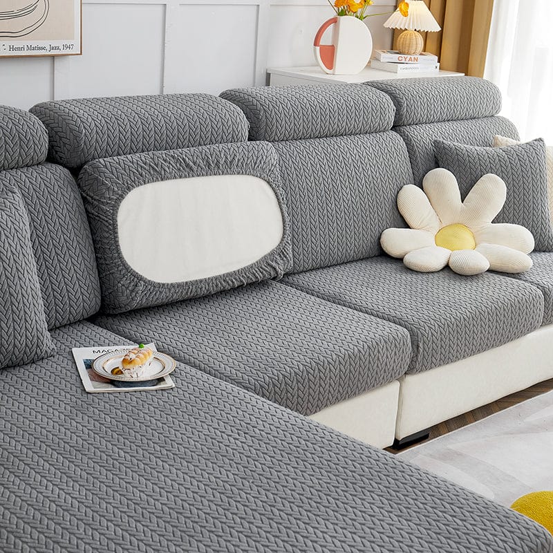 Vue latérale d'un coussin recouvert de housse polaire grise
