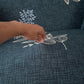Housse de canapé extensible ajustée sur un canapé d'angle