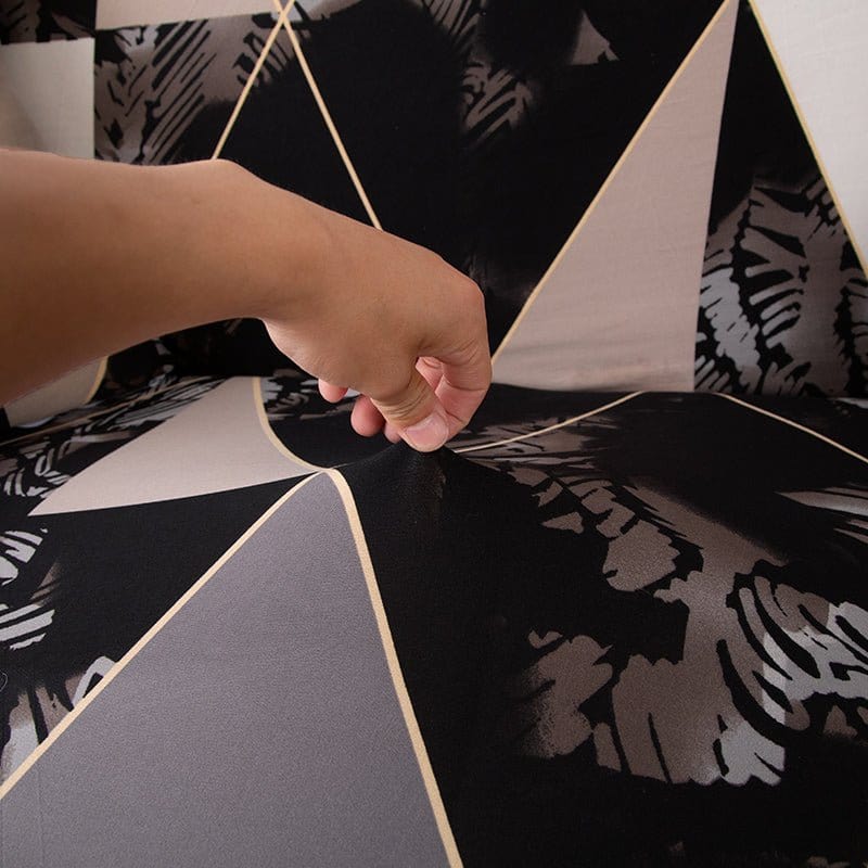 Housse de canapé extensible ajustée sur un canapé d'angle