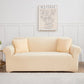 Housse extensible beige illustrée sur un canapé moderne