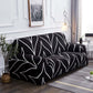 Détail du tissu extensible noir à motifs feuilles