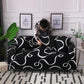 Housse extensible noire sur canapé, motif vague