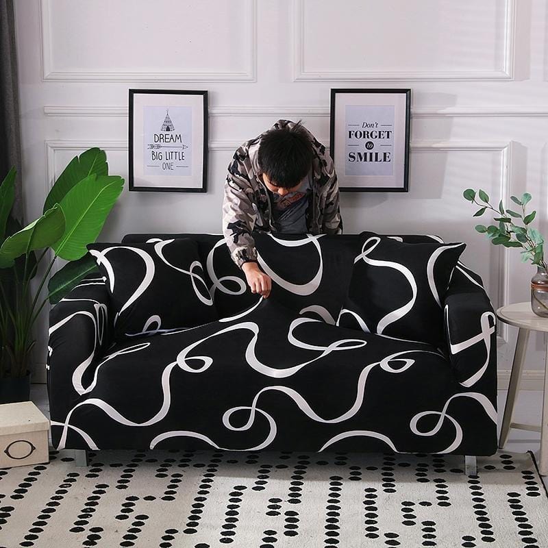 Housse extensible noire sur canapé, motif vague