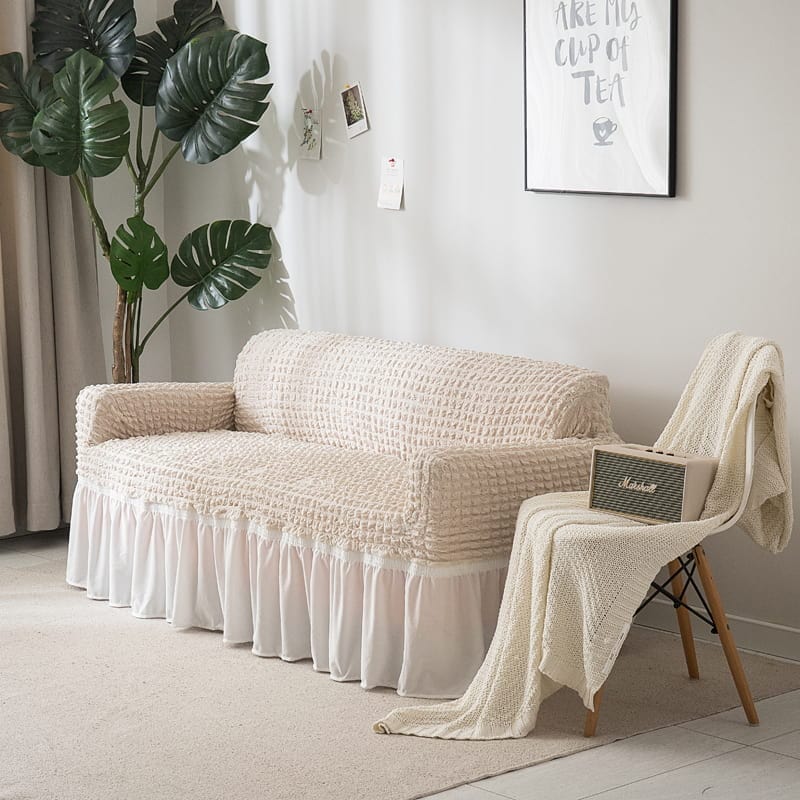 Housse extensible blanche sur canapé droit, vue de face