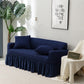 Housse de canapé bleue extensible sur un canapé droit