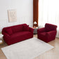 Housse bordeaux ajustée sur un canapé d'angle
