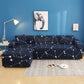 Housse extensible grise sur canapé droit moderne