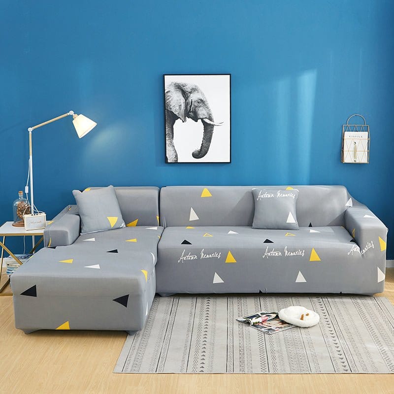 Housse extensible grise sur canapé droit moderne