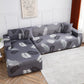 Housse grise extensible sur canapé droit moderne