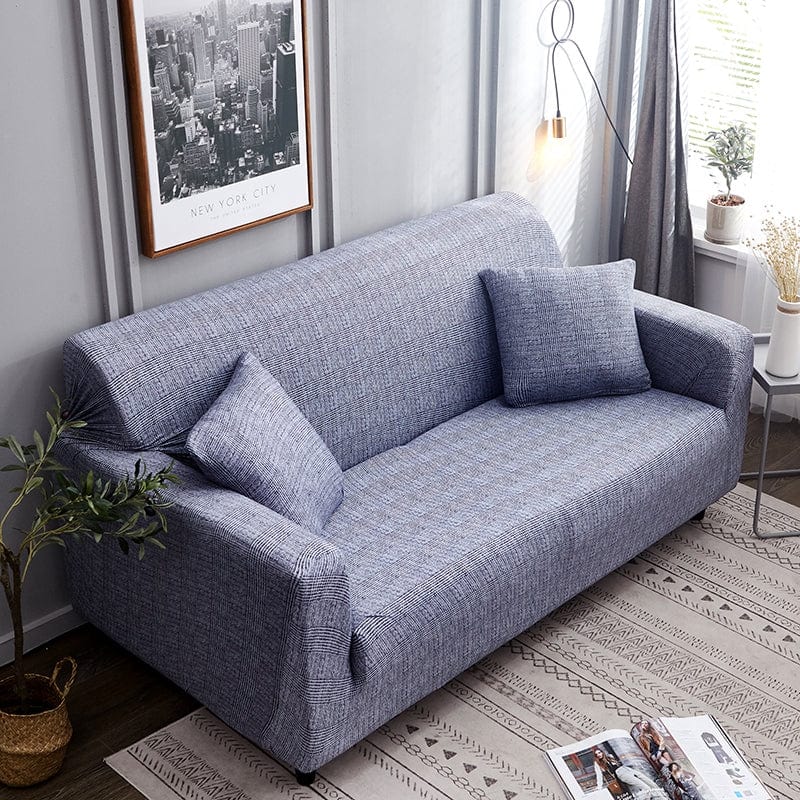 Housse de canapé grise extensible sur un canapé droit