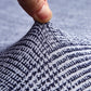 Zoom sur le tissu doux et extensible de la housse grise