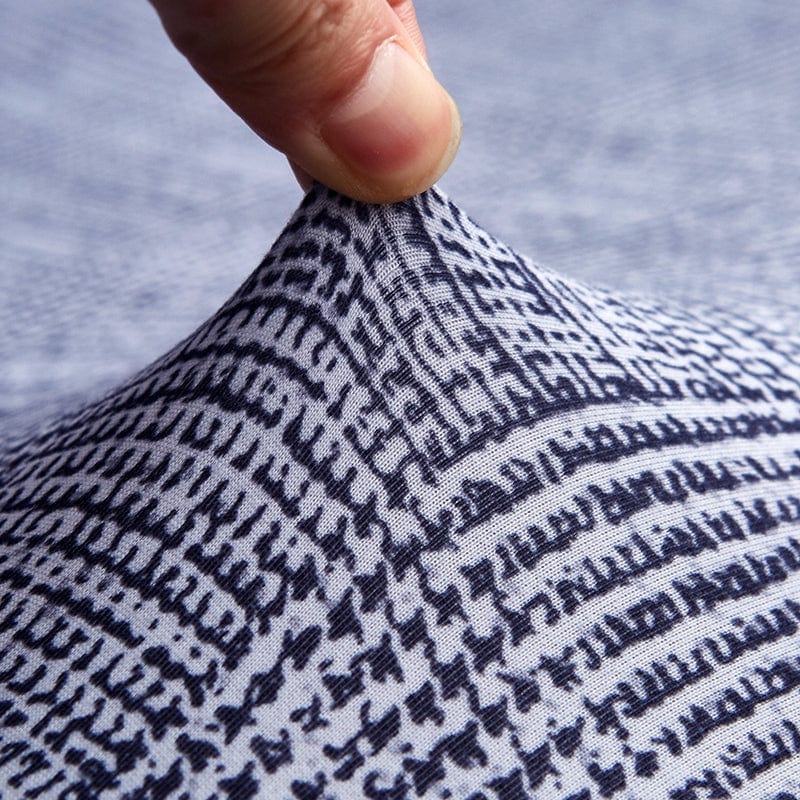 Zoom sur le tissu doux et extensible de la housse grise