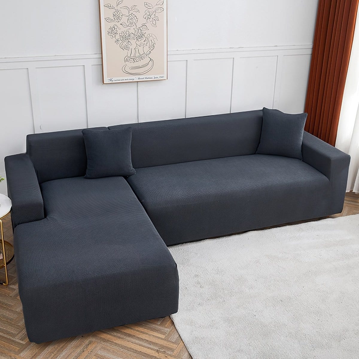 Housse de canapé grise en jacquard sur un canapé droit