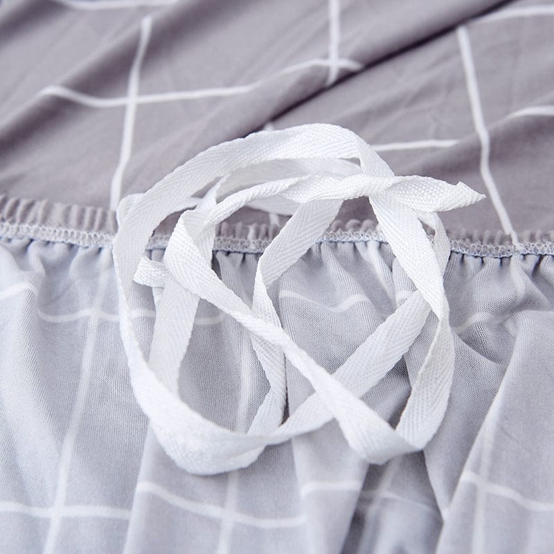 Gros plan sur la couture renforcée de la housse grise