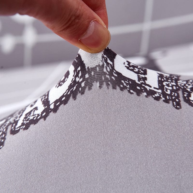 Housse extensible grise sur canapé droit, vue de face
