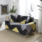 Housse extensible en jacquard couvrant un canapé d'angle moderne