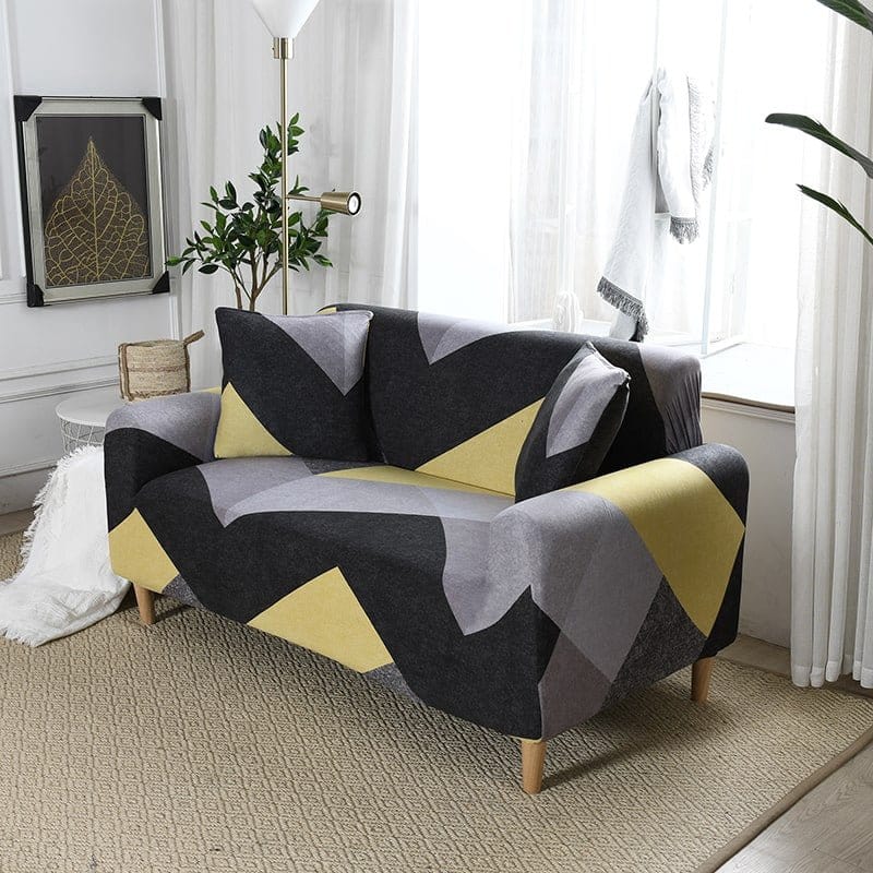 Housse extensible en jacquard couvrant un canapé d'angle moderne