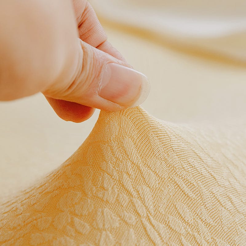 Housse de canapé jaune pâle en jacquard déperlant vue de face