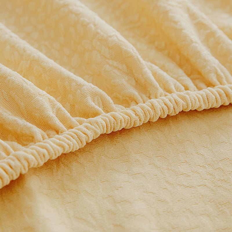 Housse de canapé déperlante installée, jaune pâle, vue d'ensemble