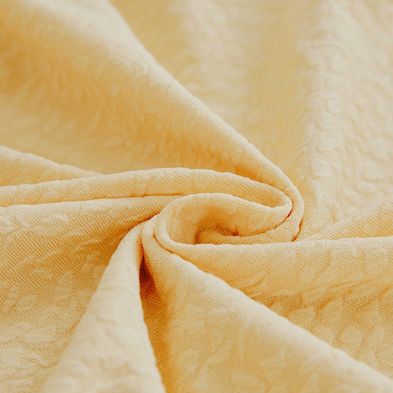 Zoom sur la texture jacquard déperlante, couleur jaune pâle